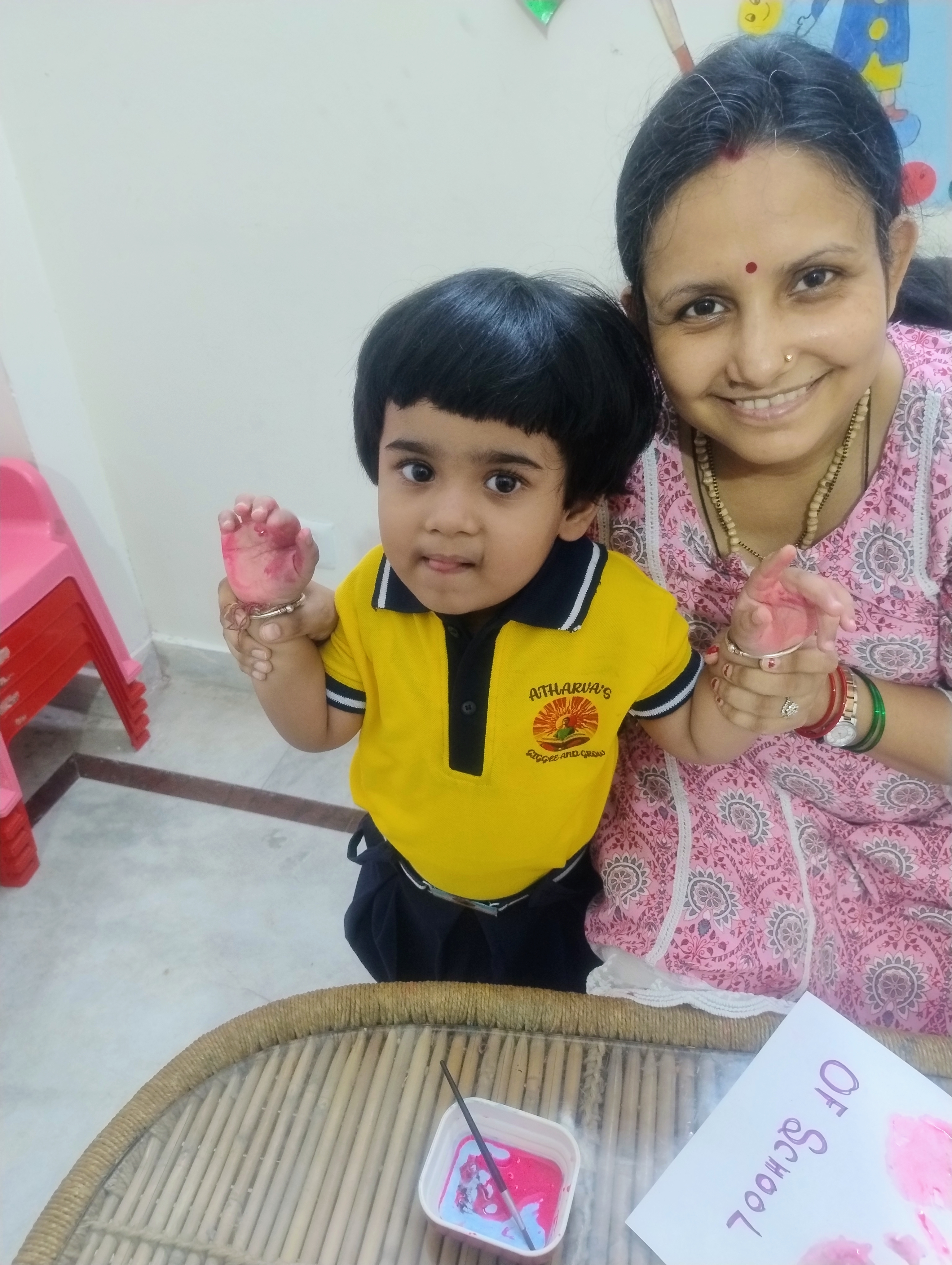 Children holding hands in a circle outdoors
